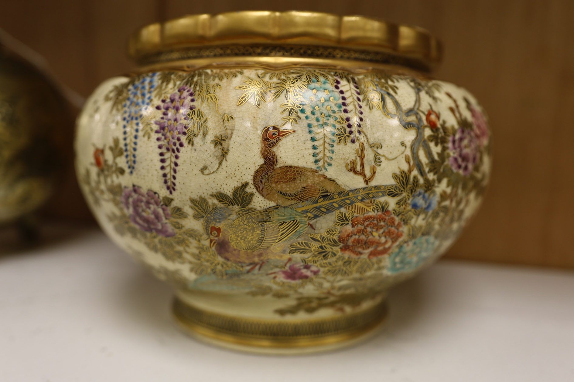 A Japanese Satsuma large bowl, 15cm high. Condition - heavily stain inside some grazing to lower rim and gilt scuffed on top rim of bowl